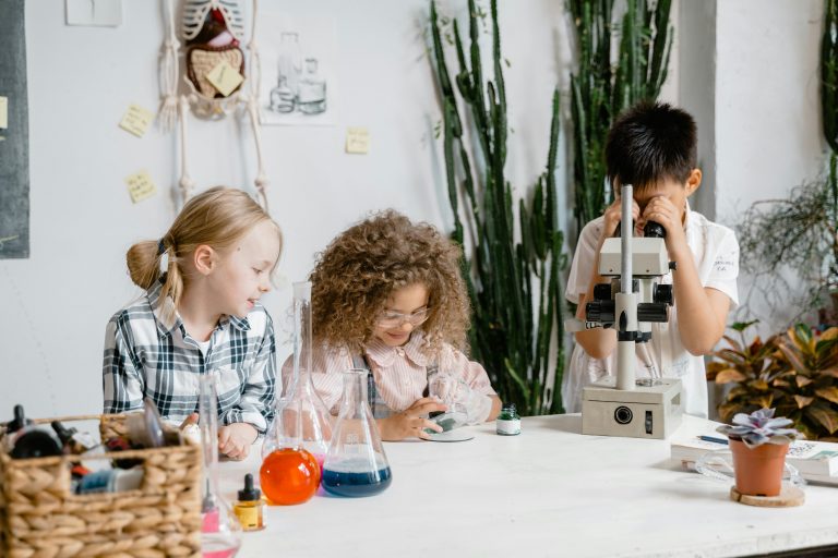 three kids doing a science experiment