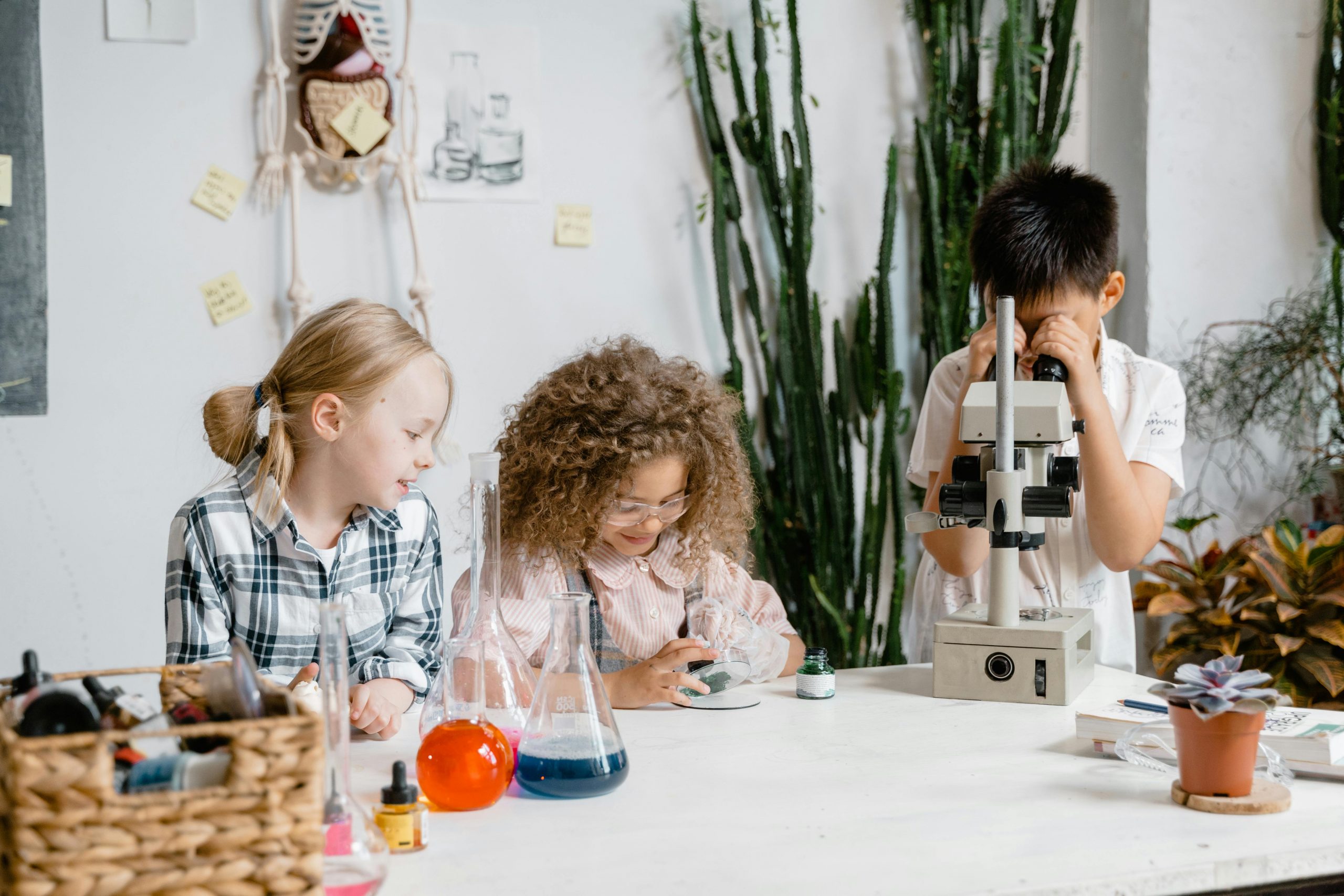 three kids doing a science experiment